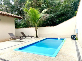 400 m te Separam das Areias da Praia de Boraceia, casa com piscina aquecida para ate 12 pessoas